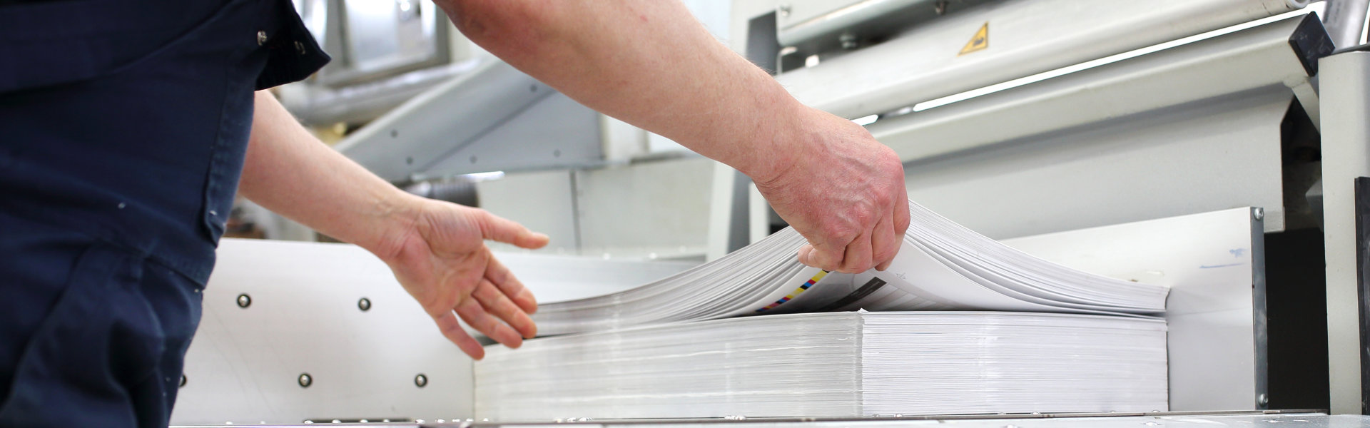 man checking printing materials